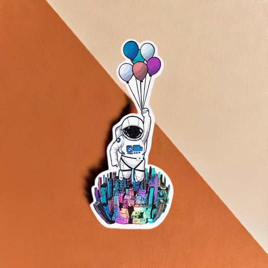 Astronaut holding balloons sticker (Holographic) - The Good Vibez Collective
