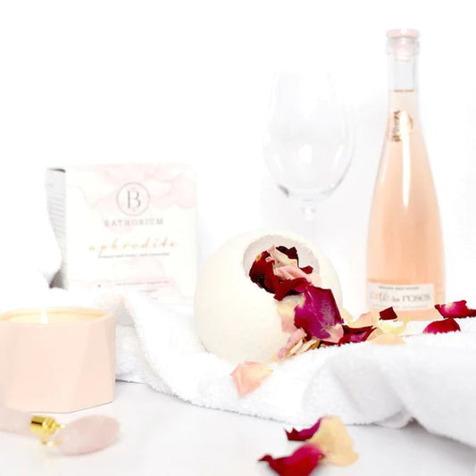 Exquisite bath bomb with rose petals and a box, infusing the water with vanilla, chocolate, and rose fragrances.