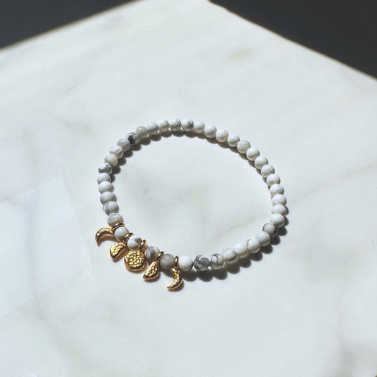 Make a statement with the Artemis gemstone bracelet, a handcrafted piece inspired by Sailor Moon. Featuring white stones and gold charms, this bracelet is out of this world!